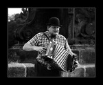 man plays on accordion