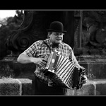 man plays on accordion